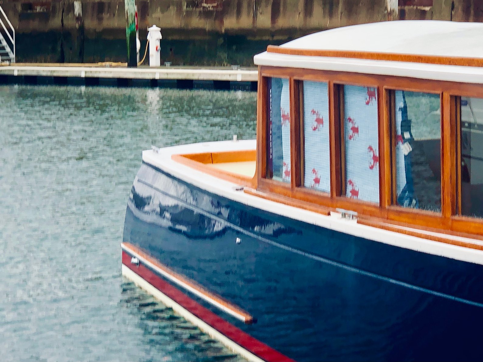 Shiny blue boat in the slip